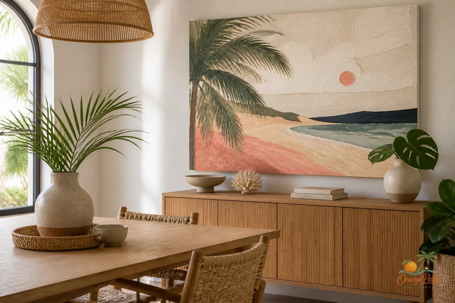 Warm modern dining room with one large coastal inspired wall art piece above a simple sideboard